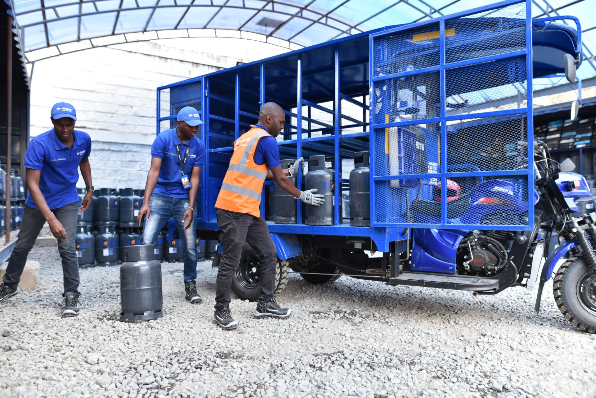 M-Gas employees loading up cylinders to a truck